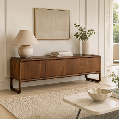 Pieces For Places Saturn mango wood 4 door media unit with curved edges and a warm natural wood grain finish.