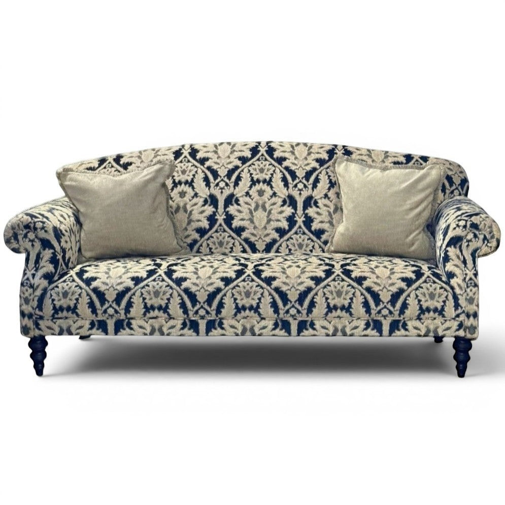 Pieces For Places Tallis Grand Sofa in navy and cream damask chenille fabric with two neutral scatter cushions and dark wooden legs.