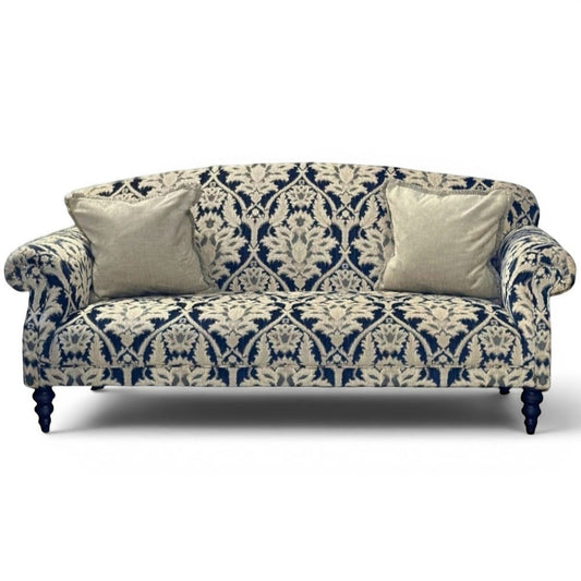 Pieces For Places Tallis Grand Sofa in navy and cream damask chenille fabric with two neutral scatter cushions and dark wooden legs.