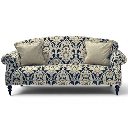 Pieces For Places Tallis Midi Sofa in navy and cream damask chenille fabric with two neutral cushions and dark wood legs.