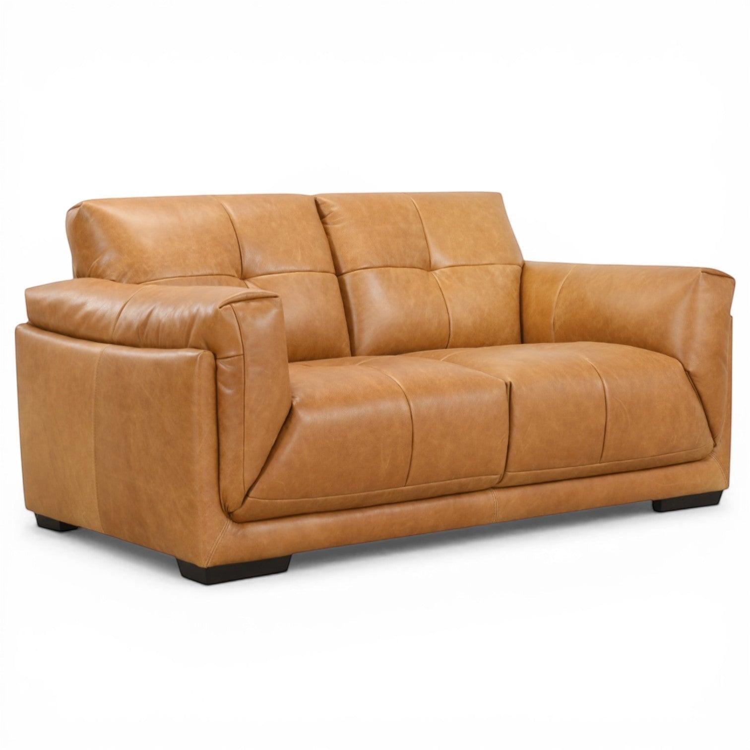 Pieces For Places Theo tan leather 2-seater sofa with tufted back cushions and low-profile dark wood feet.