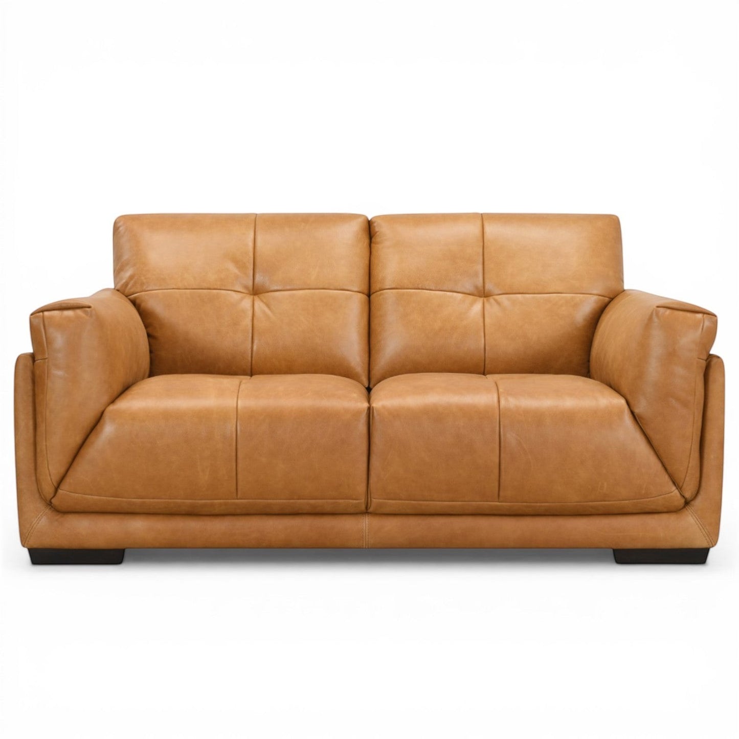 Pieces For Places Theo tan leather 2-seater sofa with tufted back cushions and low-profile dark wood feet.