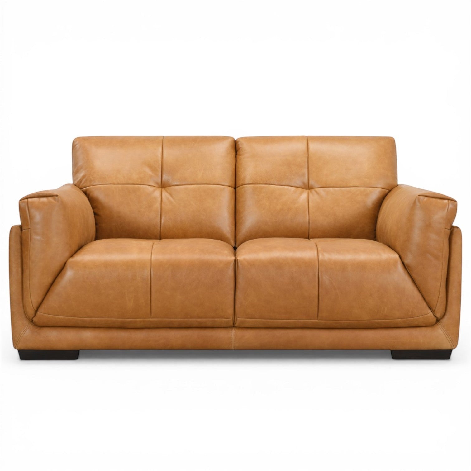 Pieces For Places Theo tan leather 2-seater sofa with tufted back cushions and low-profile dark wood feet.