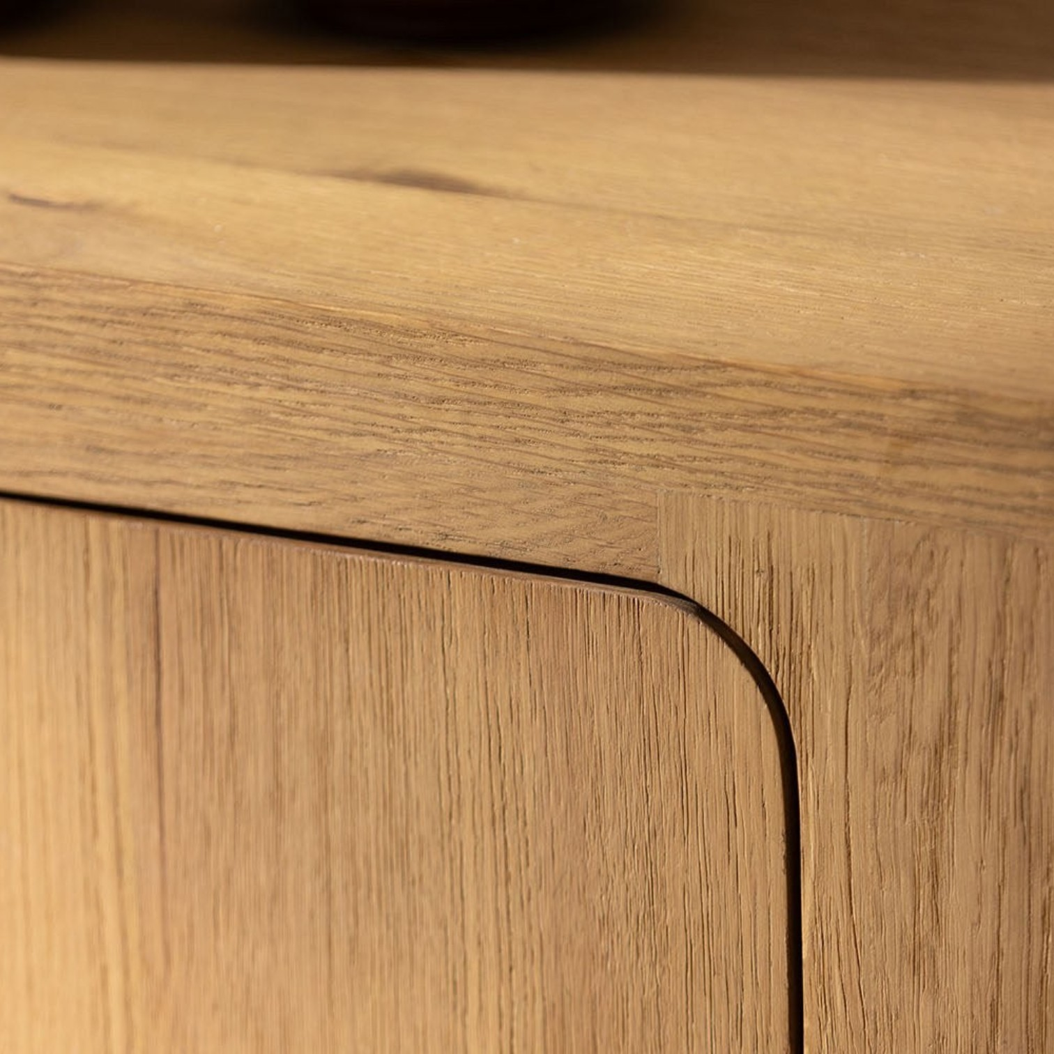 Pieces For Places Wyatt reclaimed oak sideboard showing detailed wood grain texture and rounded corner cabinet door